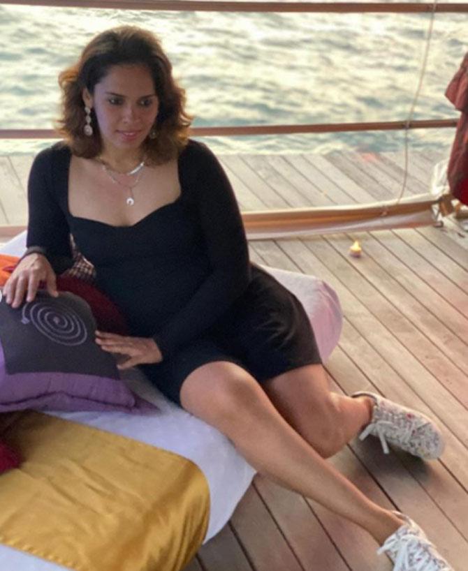 Saina Nehwal seen her posing akin to an actress or a model during a photoshoot. Saina Nehwal was not looking her best but also smiling away in all photos.