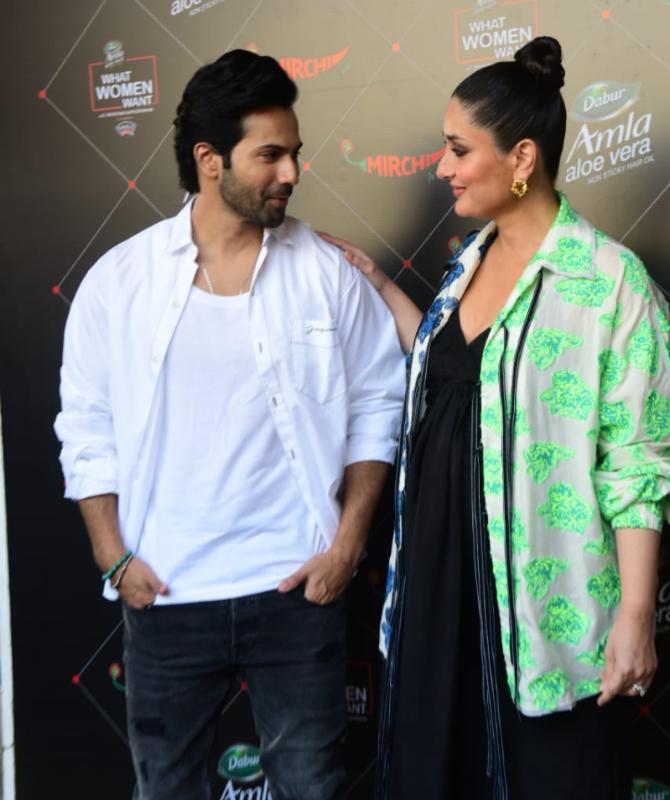 For the event, Kareena looked gorgeous in her blue-and-green two-tone batwing sleeve shirt. She completed her outfit a pair of black flips flops and tied her hair in a bun. Talking about Varun, the actor opted for a white shirt and denim along with a pair of black sneakers.