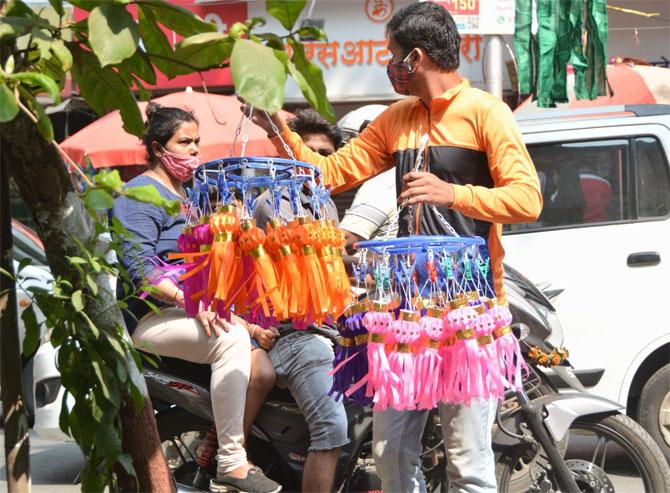 As Mumbai opened under the Mission Begin Again, residents armed with face mask, hand gloves and hand sanitisers were seen prepping up for the festival as they went about buying garlands, rangoli colours and beautiful lanterns to lit their houses.