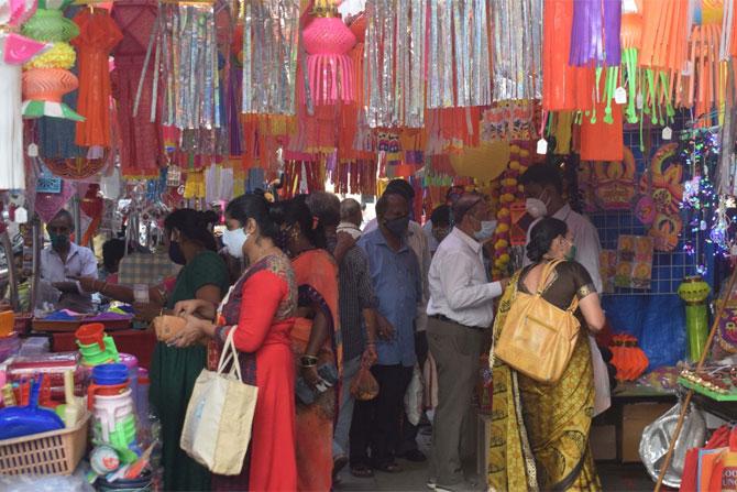 In picture: Customers glare through the variety of lanterns, diyas and stickers at a stall in Kandil Galli.