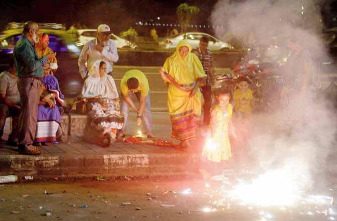 A throwback picture shows people celebrating Diwali at Marine Drive in 2019.