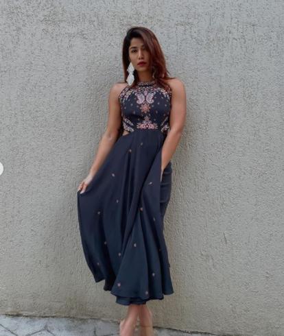 Fit and flare dress: Instagram fashion influencer Santoshi Shetty shows us the right way to practice minimalist fashion this Diwali. Pick up a fit and flare dress in muted tone with traditional print or thread work on it. Team the outfit up with dangling earring and you are good to go!