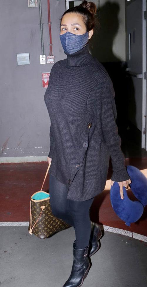 Malaika Arora aced the airport look in a long polo neck sweater and matching leggings with long boots. She also wore a grey face mask. Malaika's Instagram account was filled with photos and videos from the serene locales of Dharmashala. She also shared a picture with Kareena Kapoor Khan and Taimur Ali Khan and captioned it, 