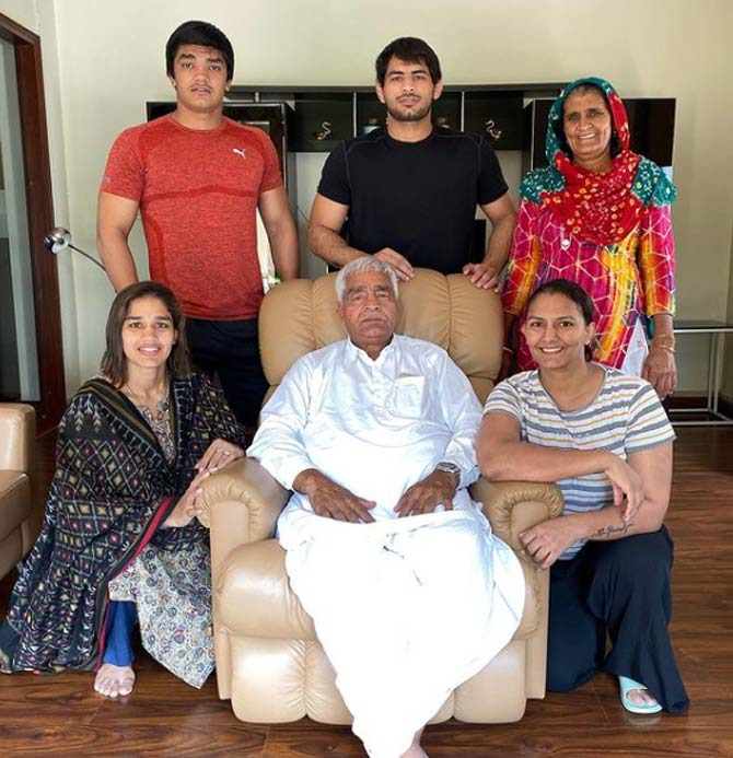 Babita Phogat's father Mahavir Singh Phogat was an amateur wrestler during his time and went on to coach his daughters to become professional wrestlers against all odds in a male-dominant society.
In picture: Babita with her parents, siblings and brother-in-law.