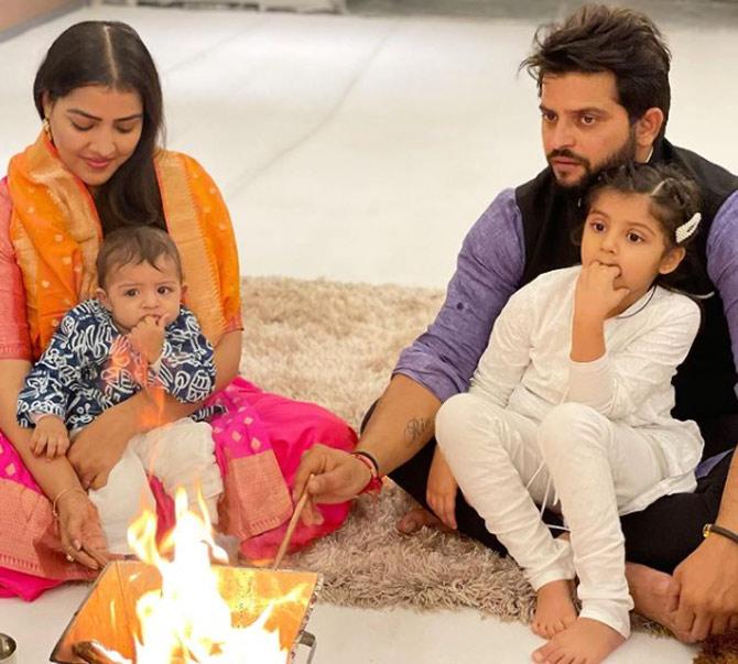In picture: The Rainas - Suresh, Priyanka, Gracia and Rio - celebrating Diwali 2020 in Delhi. Raina captioned this photo: Most special Diwali ever with Rio joining me, Priyanka & Gracia for our yearly puja & rituals. On top, this Diwali Puja is combined with grahpravesh to our new house.