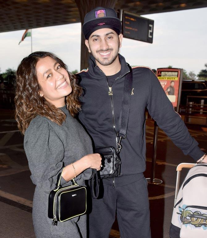 Neha Kakkar and husband Rohanpreet Singh were all smiles as they posed for the photographers at the Mumbai airport.