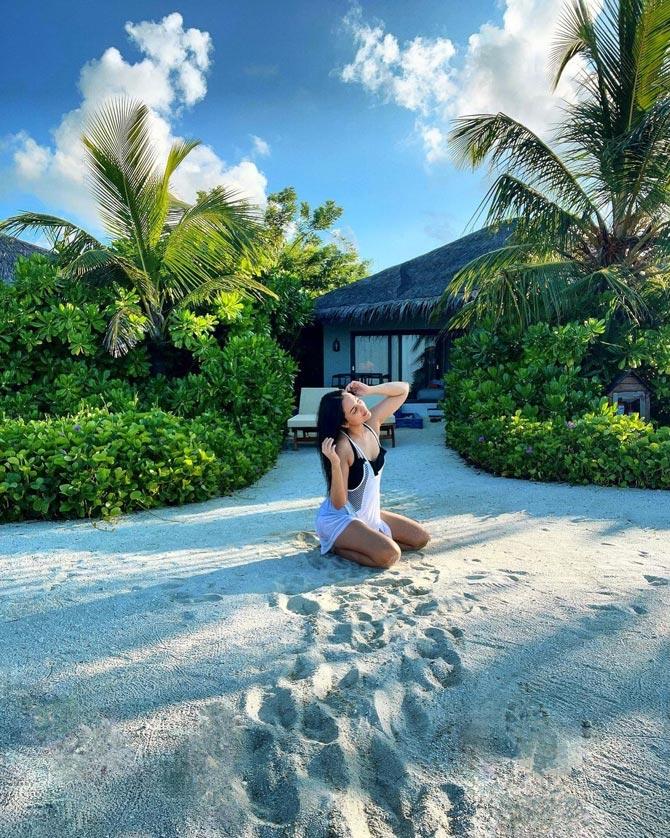 Coming back to Sonakshi Sinha, the actress posted this picture, amid the scenic view of the exotic location, sporting a no-makeup look with a white lacy monokini and open hair. In the backdrop are palm trees and a clear blue sky. Sinha wrote, 