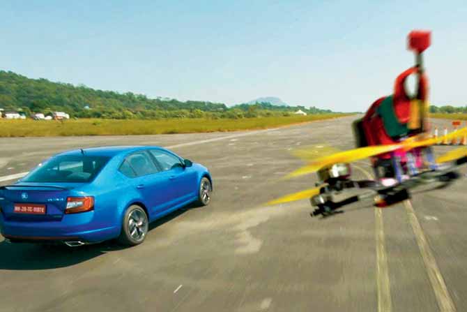 A high-speed drone captures a speeding car during an event at the Amby Valley Air Strip in Lonavala recently