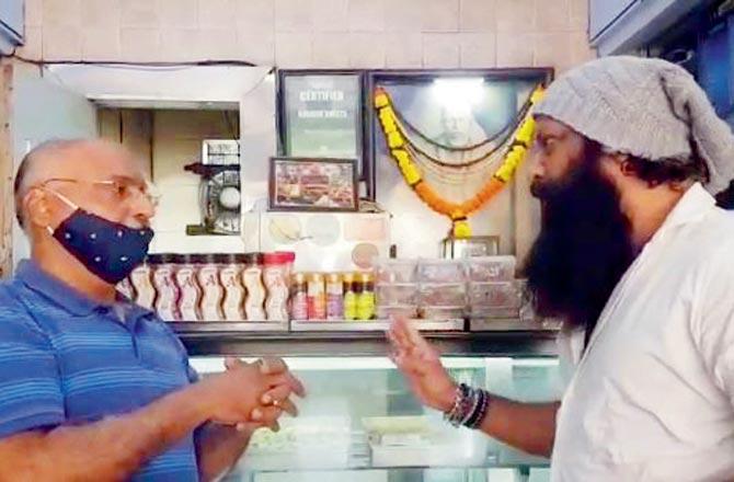 A screenshot of the viral video shows Nitin Nandgaonkar speaking with the owner of Karachi Sweets