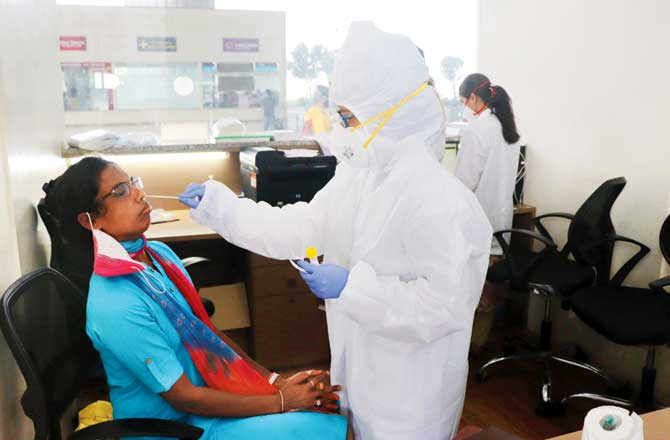 A woman gets tested at the international airport on Wednesday. Pic/Anurag Ahire