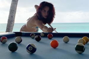 See Photo: Elli AvrRam plays pool in bikini by the beach