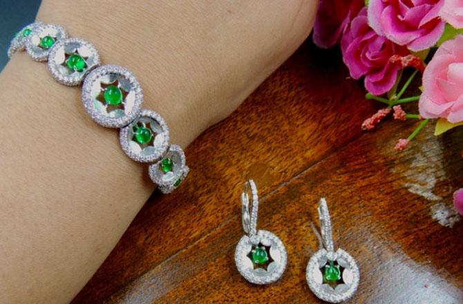 Long earrings transforming into a bracelet with the option to wear shorter earrings