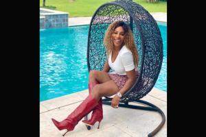 Serena Williams just loves her red boots! See photo
