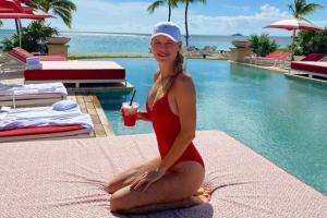 Caroline Wozniacki stuns in red swimsuit as she enjoys pool time