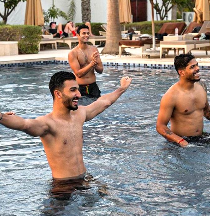 RCB's Devdutt Padikal, Shivam Dube and Umesh Yadav enjoy some volleyball in the pool at the hotel.