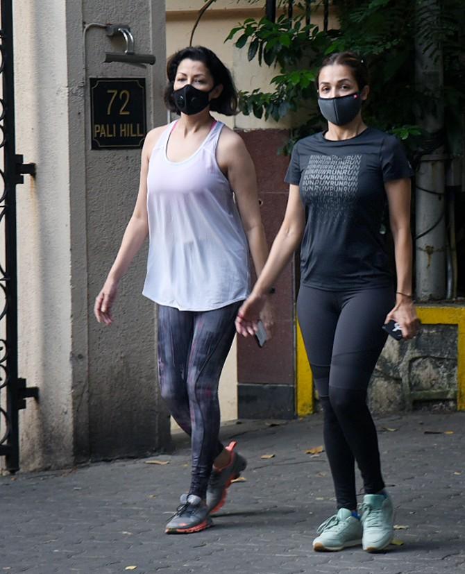 On the other hand, Aditi Govitrikar, who turned 44 this May wore a grey crop top and leggings. She paired her outfit with a pair of grey sneakers and opted for a black mask.