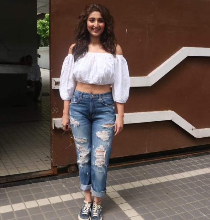 Singer Dhvani Bhanushali sizzled in her white crop top and denims when snapped at T-Series' old office in Andheri, Mumbai.