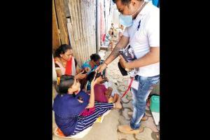 With no jobs, teachers inspire slum women into mask-making