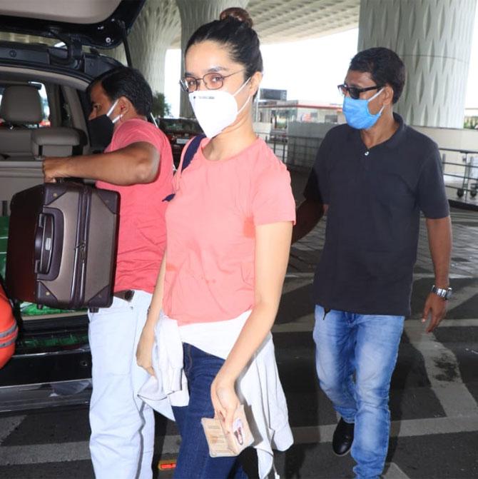 Shraddha Kapoor kept it simple in an orange coloured top and denim as she arrived at the Mumbai airport. She also wore a protective face mask. Shraddha Kapoor made her Bollywood debut with Teen Patti in 2010 and did Luv Ka The End in 2011. Fame happened with Aashiqui 2 in 2013 and she went on to deliver hits like Ek Villain, Haider, ABCD 2, Baaghi and Chhichhore.