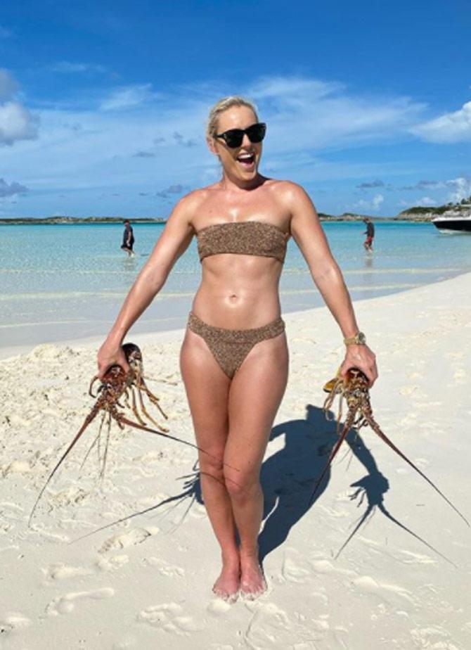 Lindsey Vonn with a catch at the beach. Vonn was seen sporting a stunning two-piece bikini.