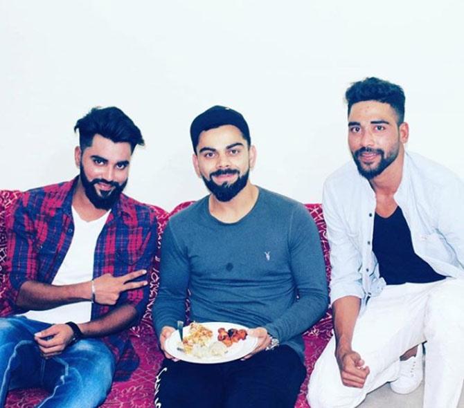 For Royal Challengers Bangalore, Mohammed Siraj has taken 11 wickets in three different seasons (2018, 2020, 2021).
In picture: Mohammed Siraj with Virat Kohli as the latter enjoys a meal at Siraj's home