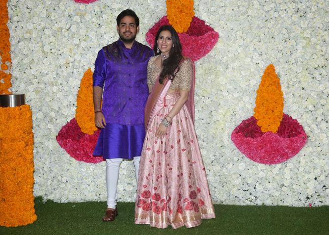 Akash, who walked in with wife Shloka Mehta, looked suave in a blue sherwani as he completed his look with a jacket in hues of blue.