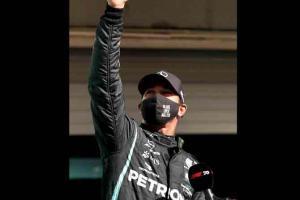 Record-seeking Lewis Hamilton grabs dramatic late pole in Portugal