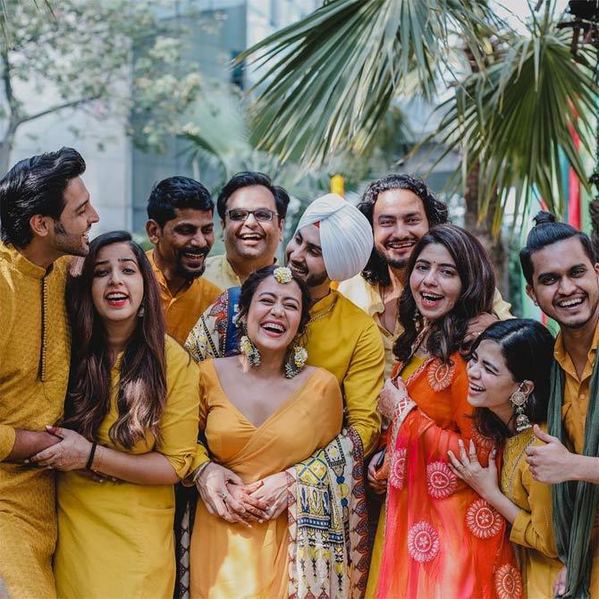 For the unversed, as a judge on Indian Idol, Neha Kakkar was part of a wedding hoax with anchor Aditya Narayan on the reality show last year. It all started when Aditya Narayan's father, Udit Narayan spoke about his son marrying Neha.
In picture: Neha Kakkar and Rohanpreet Singh with their guests at their haldi ceremony.