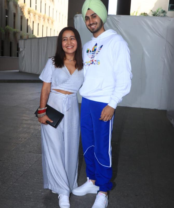 Singer Neha Kakkar tied the knot with Punjabi singer-actor Rohanpreet Singh on October 24. The newly-wed couple was spotted at the Mumbai Airport along with their family. (All pictures: Yogen Shah).
