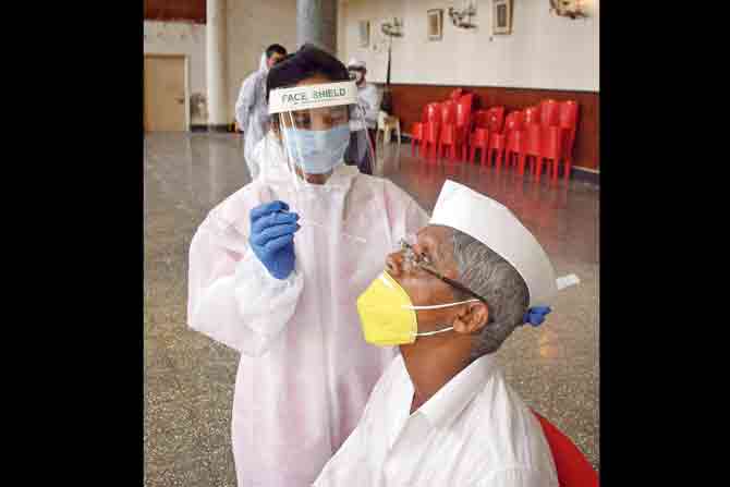 A health worker conducts a COVID-19 test at Worli. PIC/ASHISH RAJE