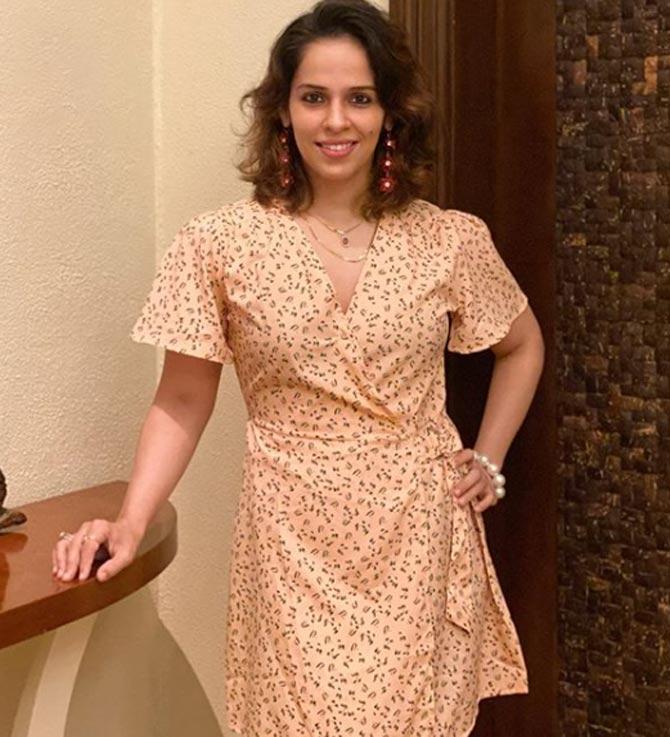 Saina Nehwal poses gracefully in a fashionable dress that she opted to wear for dinner.