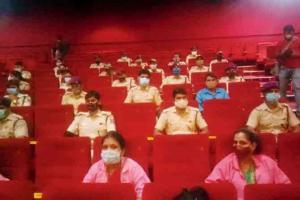 In Delhi multiplex, three people can step out at a time during interval