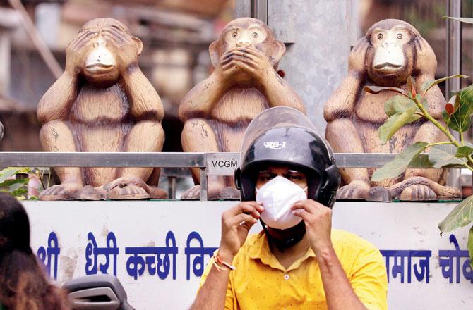 A man adjusts his mask in Andheri. Pic/Anurag Ahire