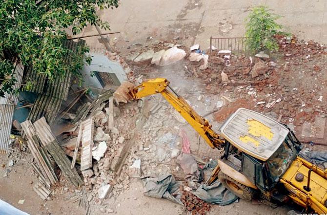 BMC teams demolish some other structures on Shivdas Chapsi Marg to widen the road