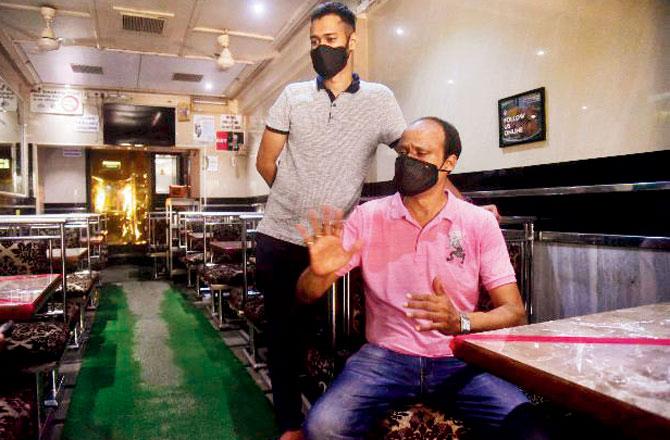 Umesh Shetty, owner of Durga Restaurant and Bar with his son Anish. Pic/Pradeep Dhivar