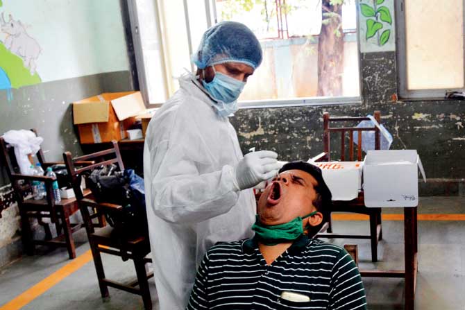 BMC doctors conduct a swab test at Dhanji Devasi BMC school, Ghatkopar East, on Friday. PIC/SAYYED SAMEER ABEDI