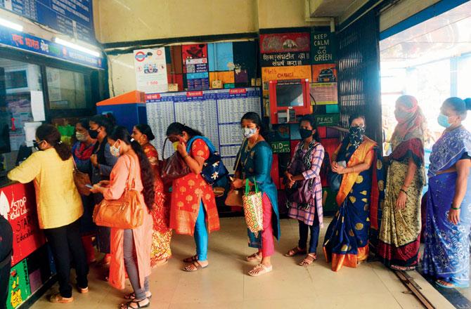 Women queue up at a ticket counter at Borivli station. Pics/Satej Shinde