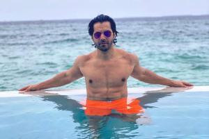 Varun Dhawan jets off to Maldives, shares pictures flaunting his abs