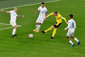 Sancho, Haaland rescue toiling Dortmund in game that won't be historic