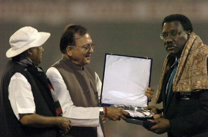 In picture: Clive Lloyd (R) receives an award from former Indian Sports Minister, the late Sunil Dutt (C) as former West Bengal state sports minister Subhash Chakroborty (L) looks on during an award ceremony at the Eden Gardens Stadium in Calcutta, 13 November 2004.