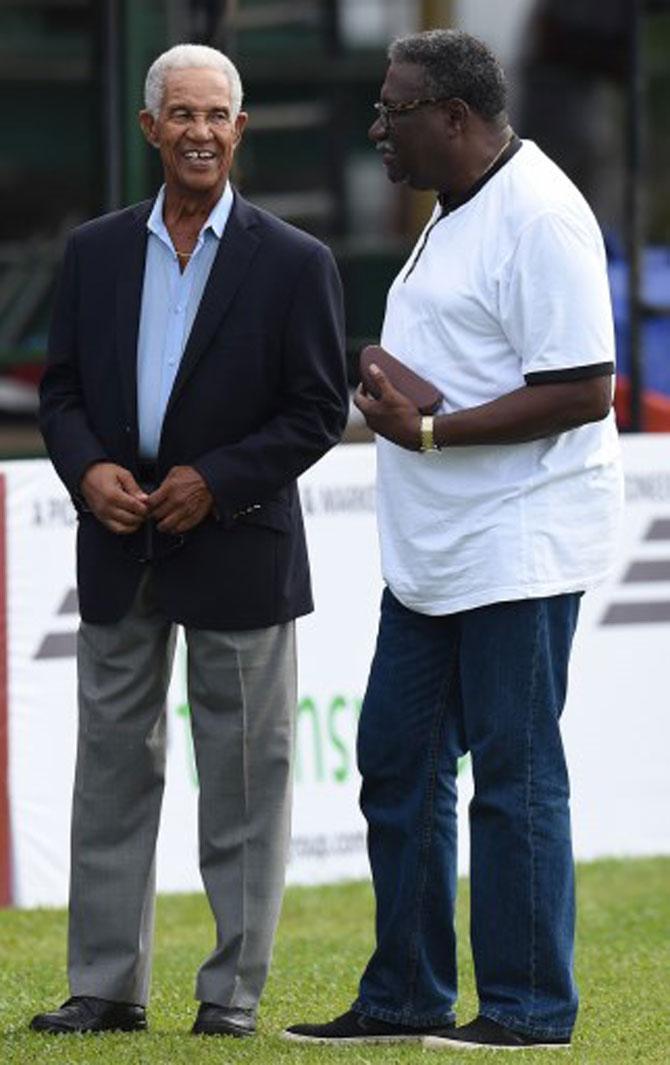2 legends, 1 photo! Clive Lloyd (R) speaks with West Indian cricket legend Sir Garfield Sobers (L) during a West Indies practice session at the P. Sara Oval Cricket Stadium in Colombo on October 21, 2015.