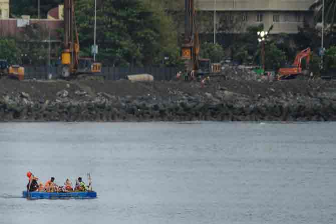 In picture: BMC workers carry idols in a boat into the Arabian sea for immersion during Anant Chaturdashi celebrations in Mumbai.