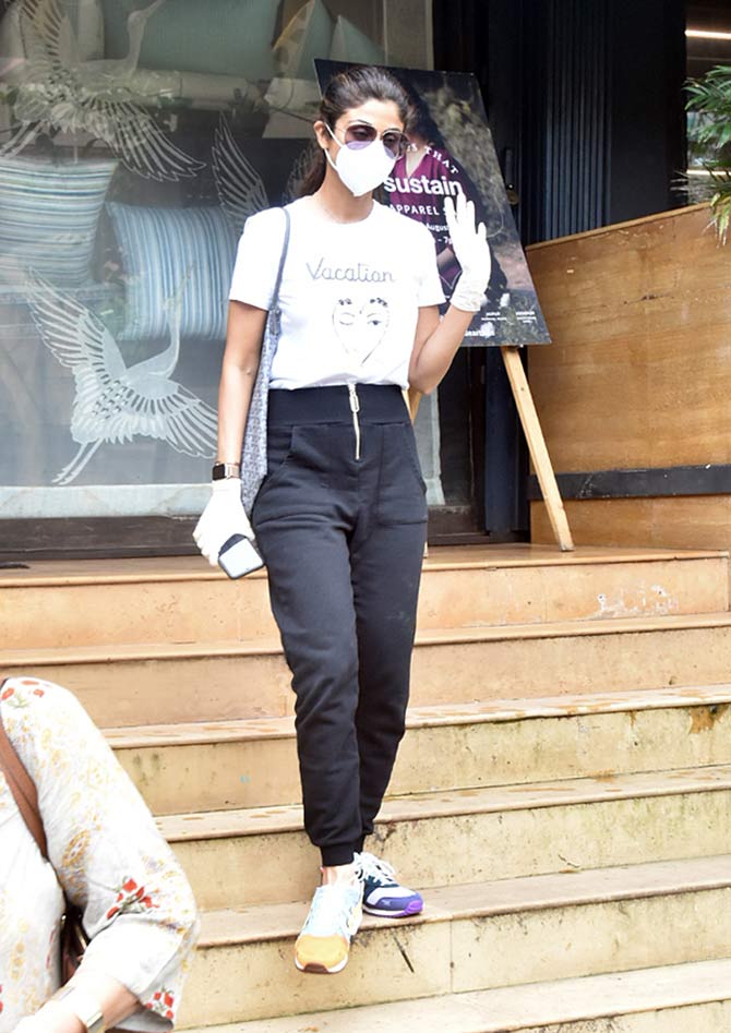 Shilpa Shetty Kundra was spotted with her mother-in-law in Mumbai. The actress was seen wearing black joggers, paired with a white crop top during the outing. All pictures/Yogen Shah