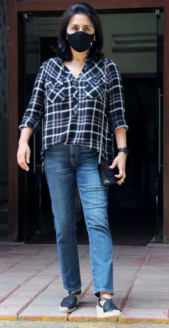 Neetu Kapoor posed for the shutterbugs when clicked in Bandra, Mumbai. The yesteryear actress sported blue checkered shirt and denim for the outing.