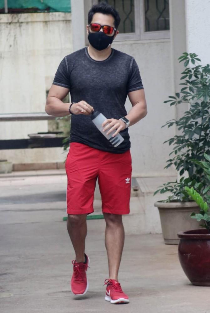 Emraan Hashmi was also clicked at a popular dubbing studio in Juhu. The actor seems in a good mood showcasing his muscles in his black t-shirt and red shorts and shoes. A pair of funky sunglasses and a black mask completed his look.