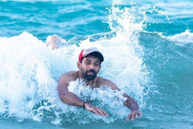 In picture: Mumbai Indians pacer Dhawal Kulkarni seems to be enjoying the waves of Dubai.