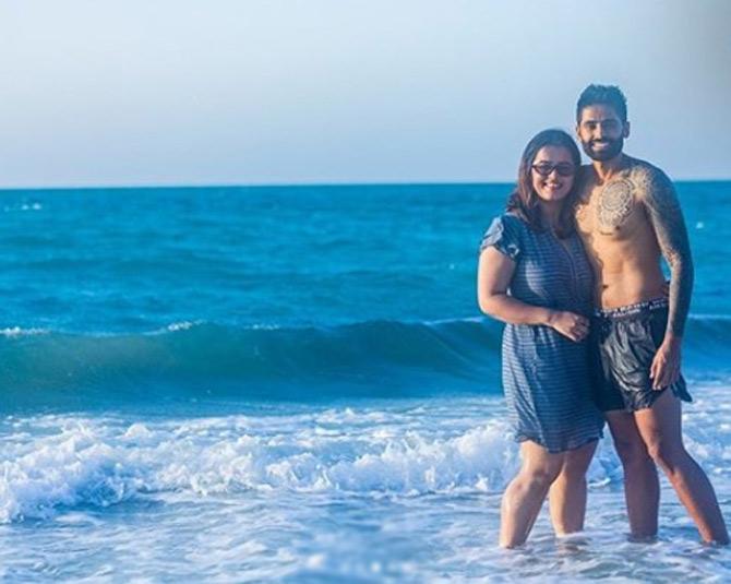 Suryakumar Yadav seen posing by the beach along with his wife Devisha Shetty. The couple tied rthe knot in 2016.