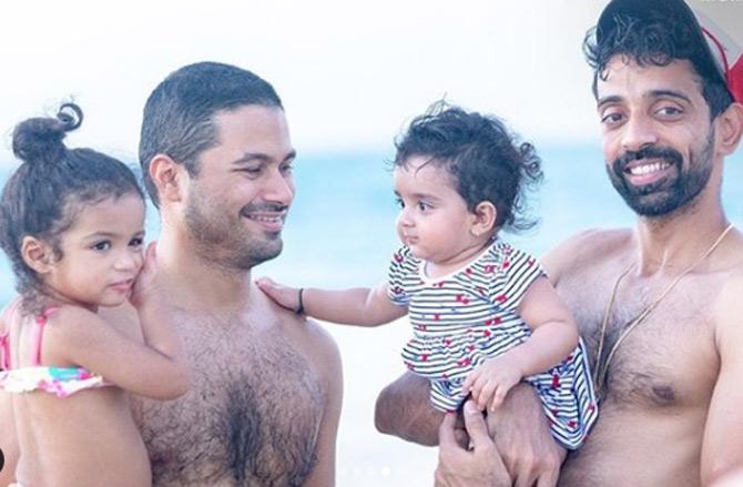 Lil Angels! Mumbai Indians players Aditya Tare and Dhawal Kulkarni with their respective daughters by the beach in Dubai.