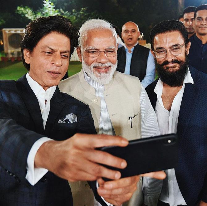 In picture: Bollywood superstars Shah Rukh Khan and Aamir Khan are all smiles as they pose for a picture with PM Narendra Modi.
