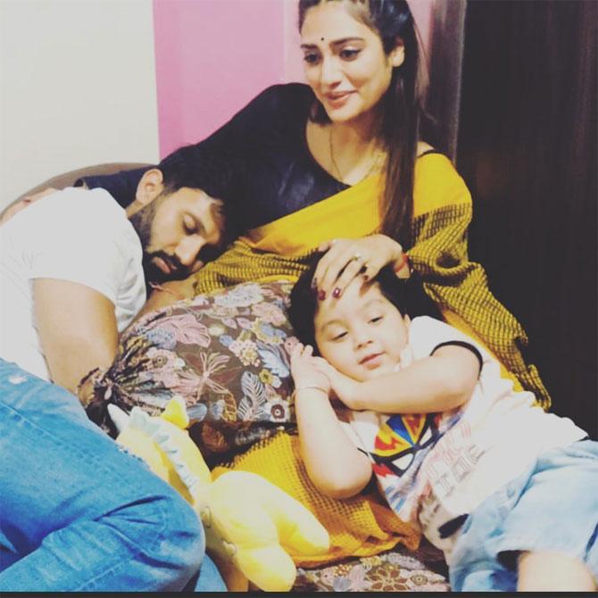 During the COVID-19 enforced lockdown, Nusrat Jahan shared this throwback picture where she is seen looking simple yet elegant in a yellow saree with floral prints. In the picture, Nusrat's husband Nikhil Jain and a small boy can be seen sleeping as Nusrat taps their head.